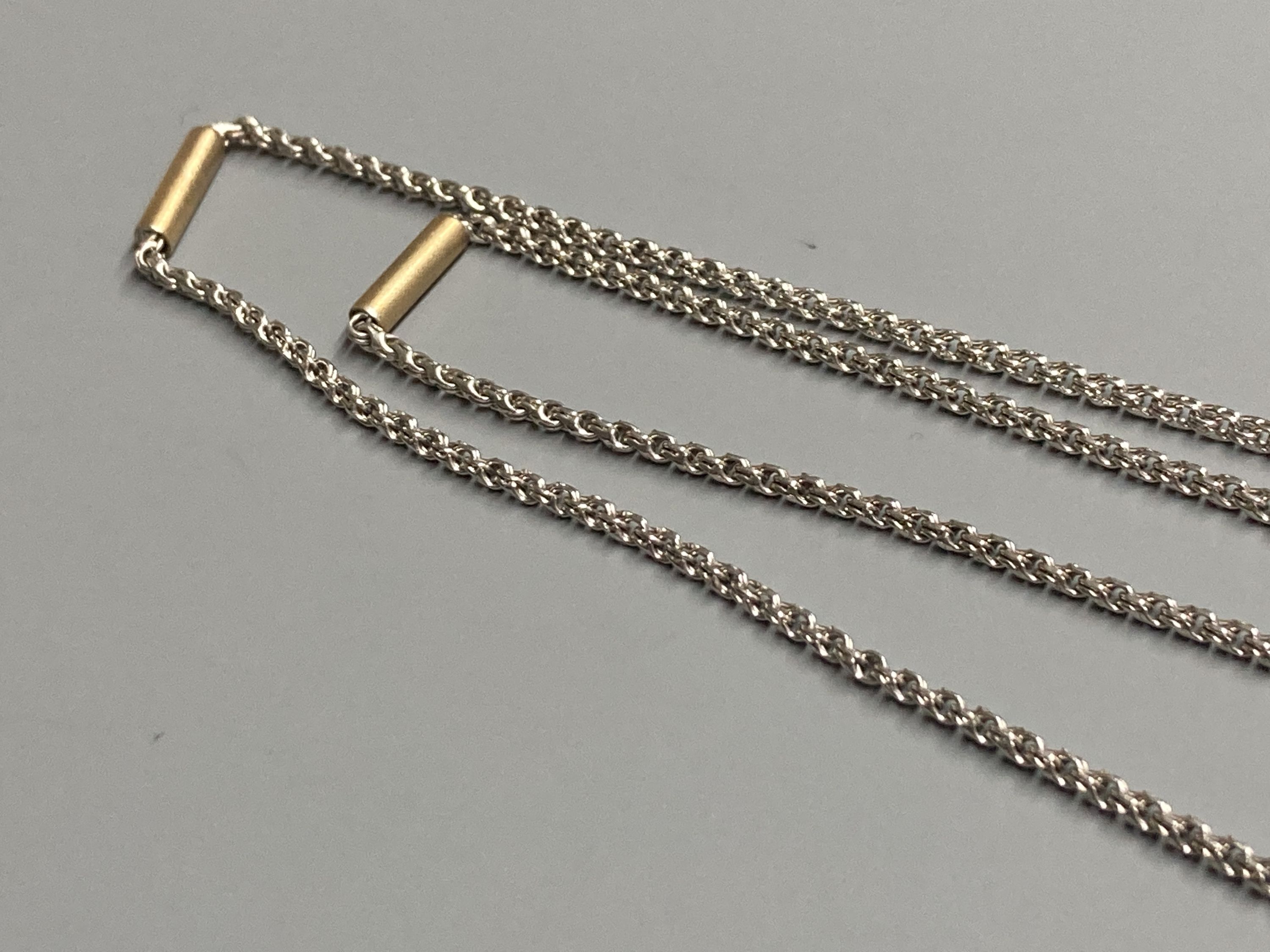 A modern 9ct white gold necklace with yellow gold baton links, 78cm